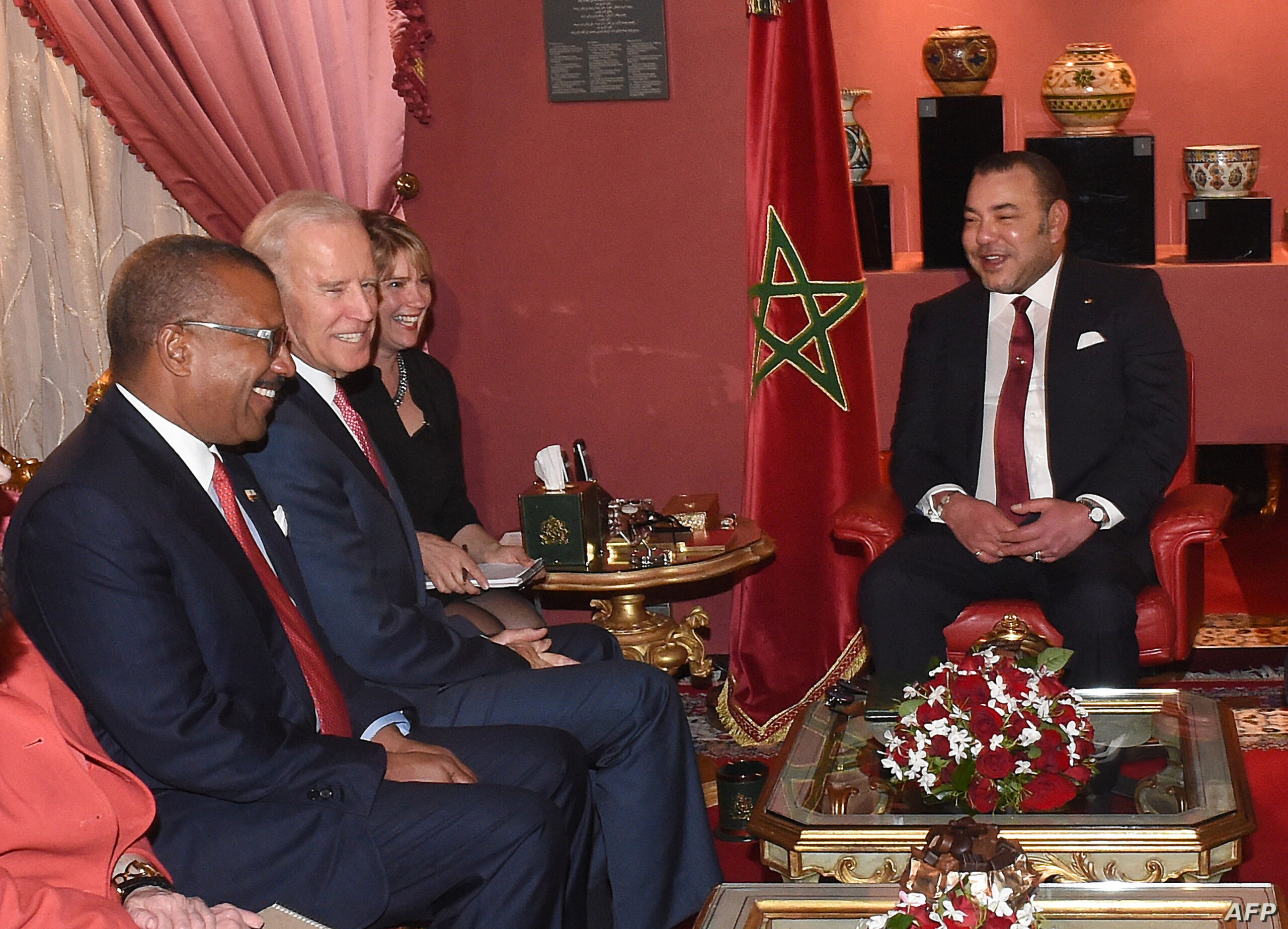 US Vice President Joe Biden (2L) smiles during a meeting with Morocco's King Mohammed VI (R) at the royal palace in Fez on November 19, 2014. Biden is attending the Global Entrepreneurship Summit in Morocco, taking place for the first time on the African continent. AFP PHOTO/ FADEL SENNA